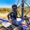 Author wearing Nexx X.WRL ATIKA helmet while riding motorcycle in desert