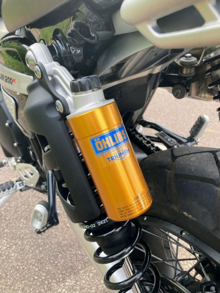 Closeup of Ohlins suspension on 2022 Triumph Scrambler 1200 XC