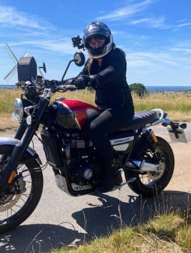 Female rider outdoors on the 2022 Triumph Scrambler 1200 XC