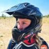 Author wearing Nexx X.WRL ATIKA helmet in desert with visor up