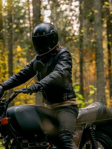 Man on a motorcycle wearing helmet and jacket