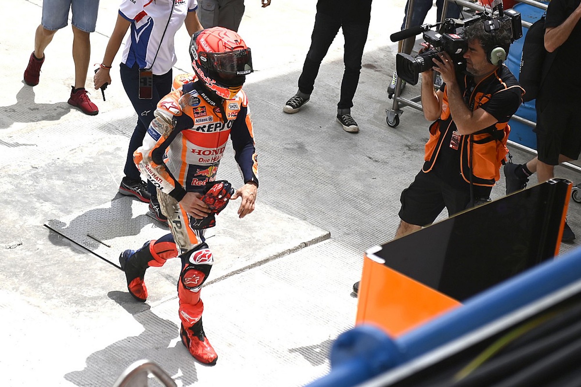 Marc Marquez walking in the paddock. Media sourced from AutoSports.