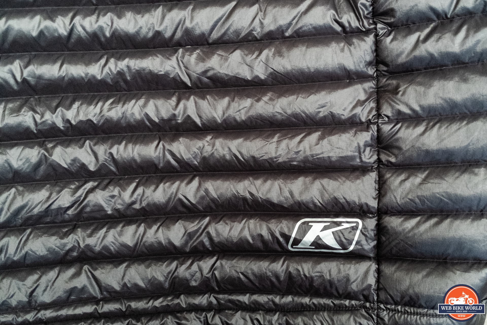Close-up of Klim logo on Maverick Down Motorcycle Jacket