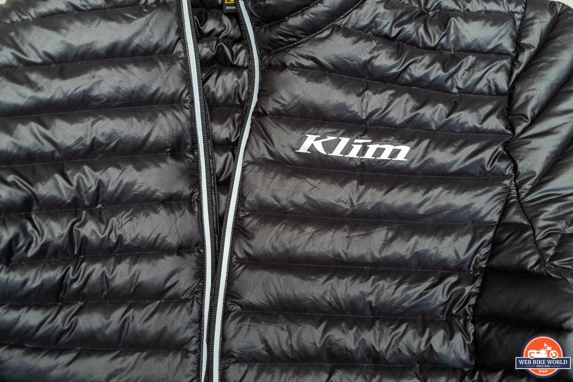 Close-up of logo on Klim Maverick Down Motorcycle Jacket