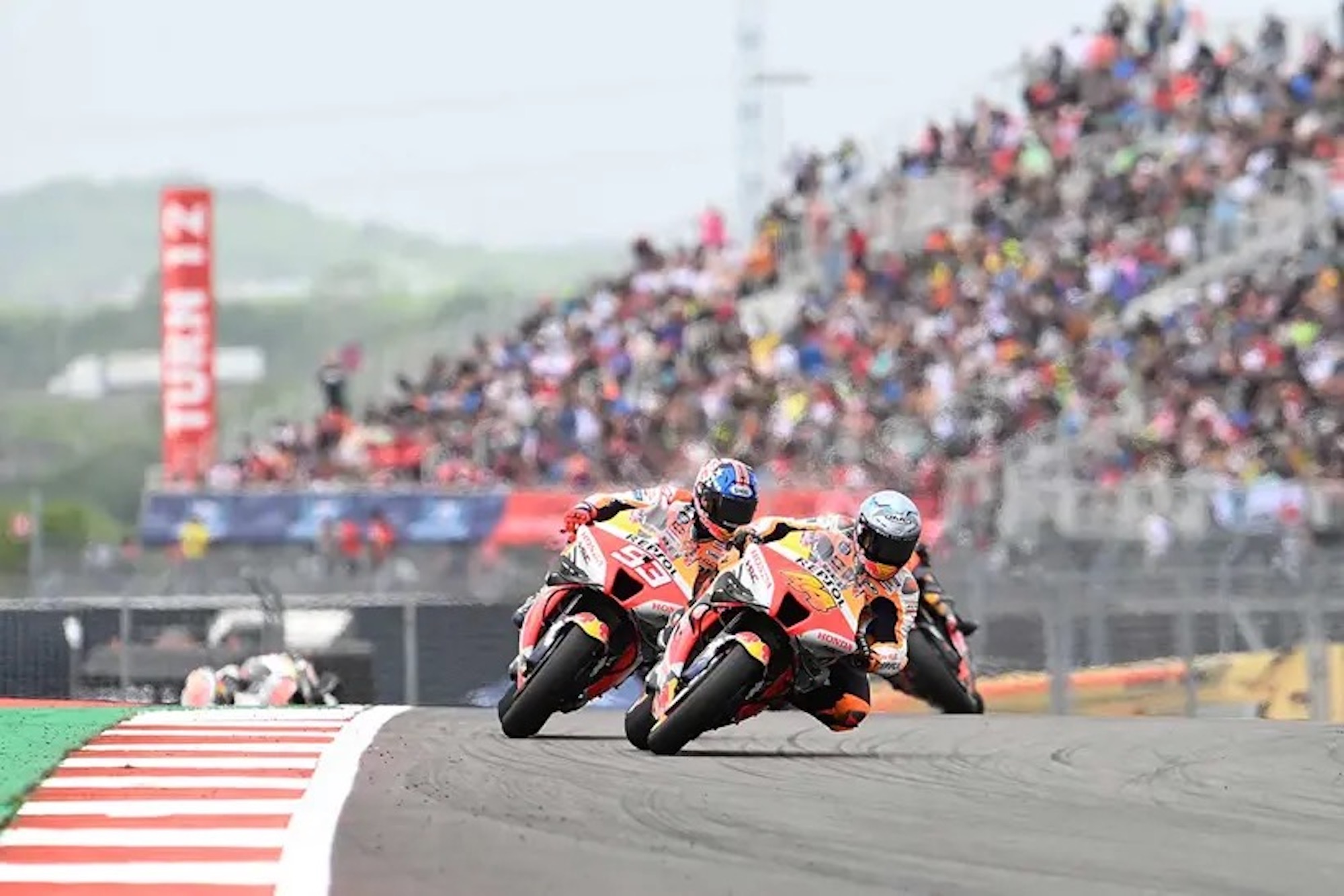 Honda's REPSOL team rounds the bend at a MotoGP circuit. Media sourced from MCN. 