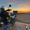 Author's motorcycle parked during sunrise in the Mojave desert