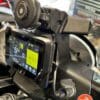 The QuadLock wireless charging head power cord plugged into the Norden’s 12V accessory outlet.