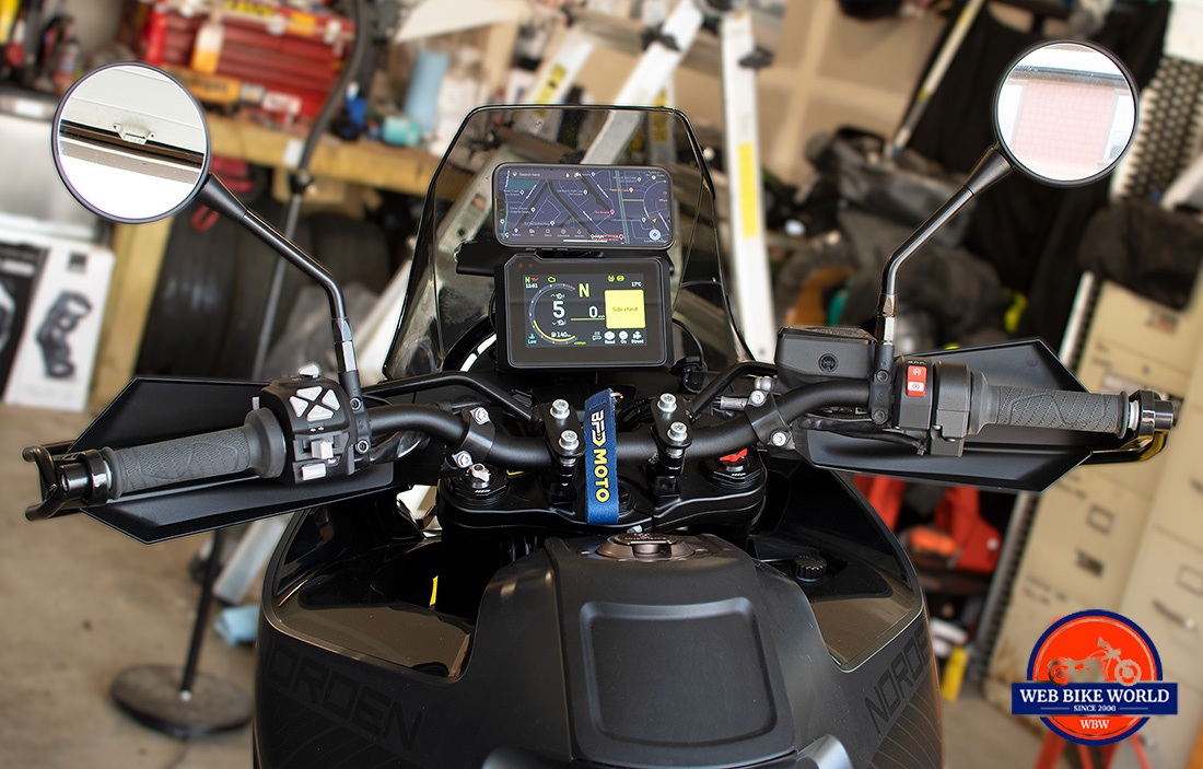 The QuadLock 360 pieces allowed me to mount my phone over the Norden dash display.