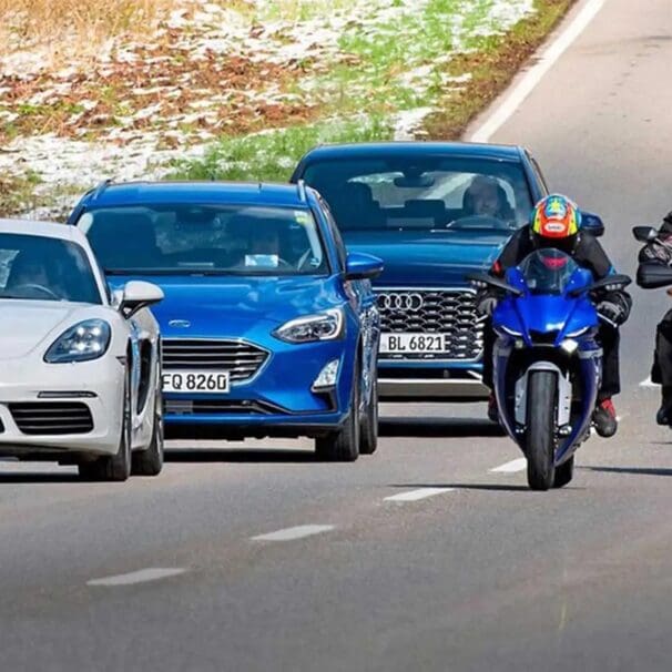 A view of cars driving next to motorcycles. Media courtesy of RideApart.