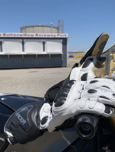 Racer High Racer Gloves resting on top of motorcycle