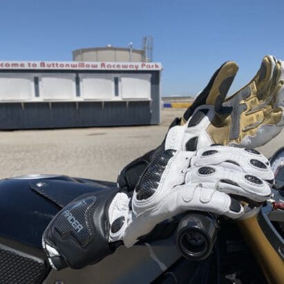Racer High Racer Gloves resting on top of motorcycle