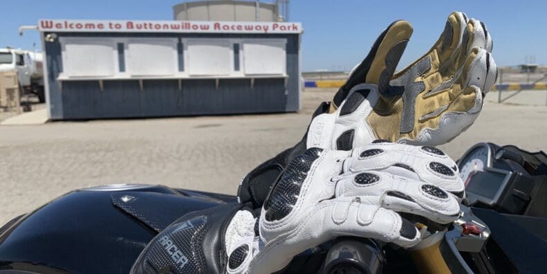 Racer High Racer Gloves resting on top of motorcycle