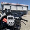 Racer gloves resting on motorcycle fuel tank