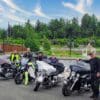 Riders standing near motorcycles outside, including author wearing REV'IT Pioneer GTX Boots