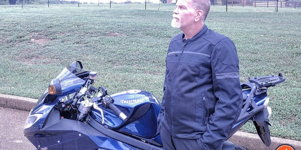 Author wearing Scorpion Cargo Air Jacket next to Triumph motorcycle