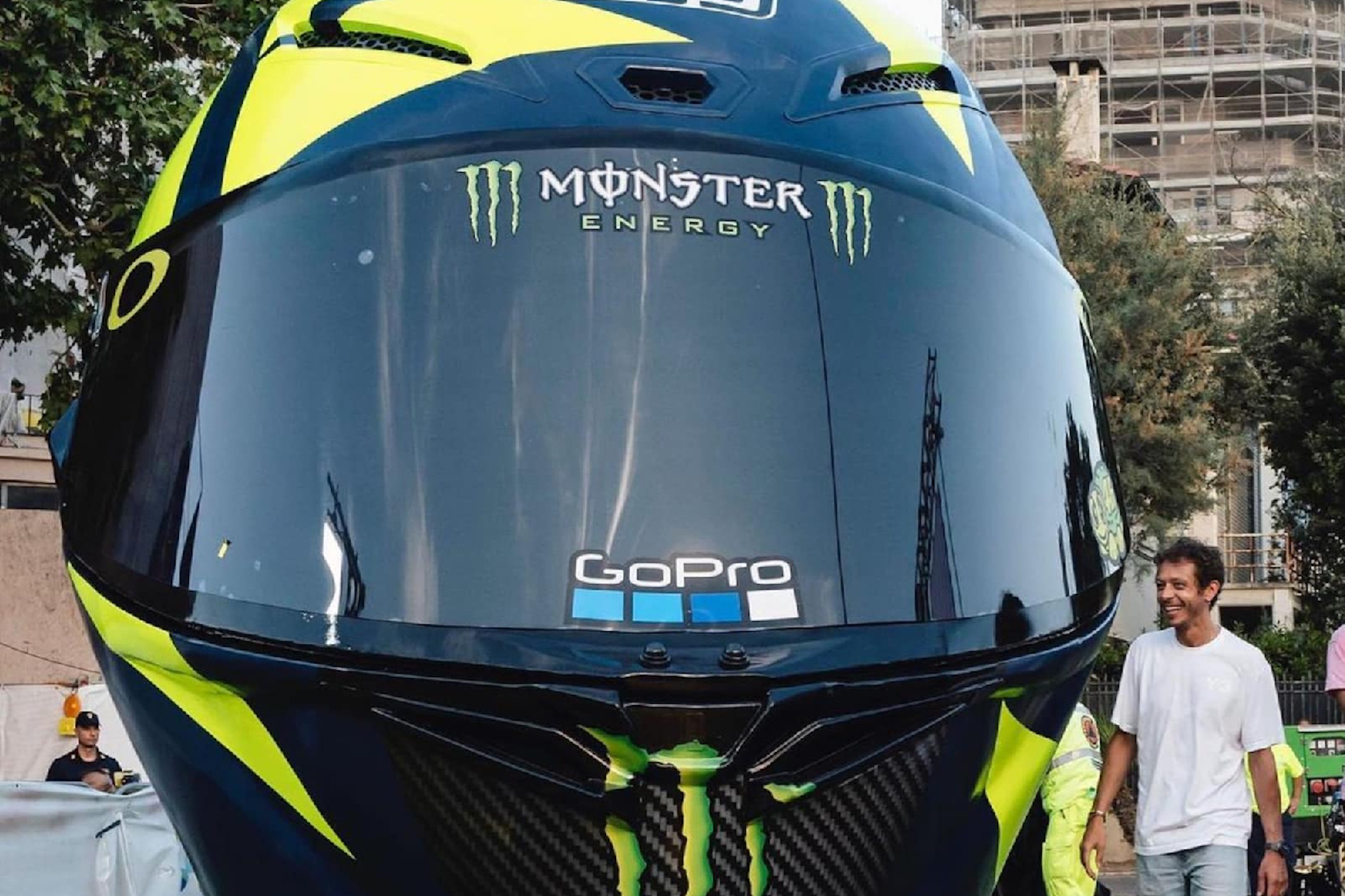 The world's biggest motorcycle helmet, featuring the source of inspiration - Valentino Rossi - beside the thing for comparison. Media sourced from SpeedCafe.