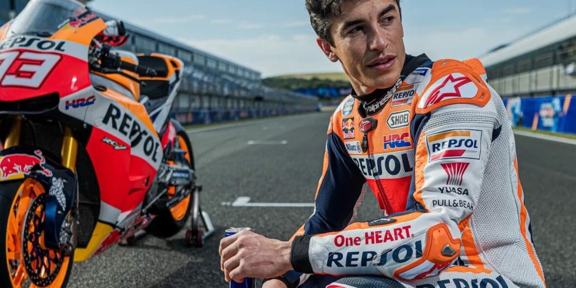 Marc Marquez with his Honda racebikje in the background. Media sourced from The Guardian.