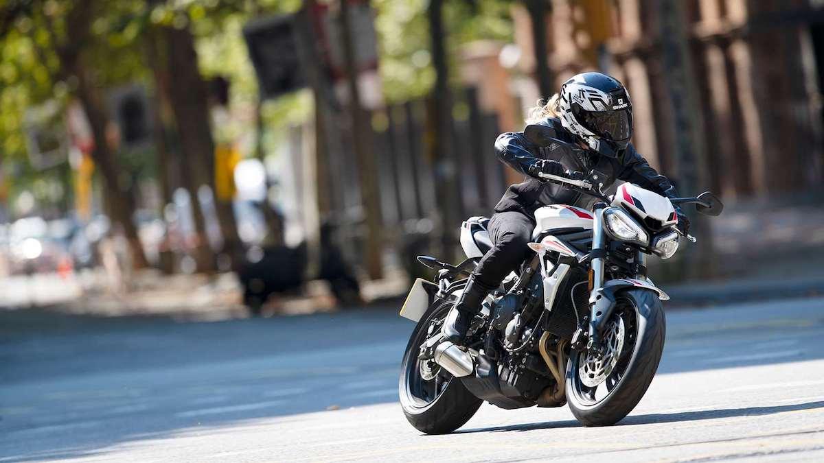 a Ducati motorcycle with rider leaning into a turn.  Media sourced from VisorDown. 