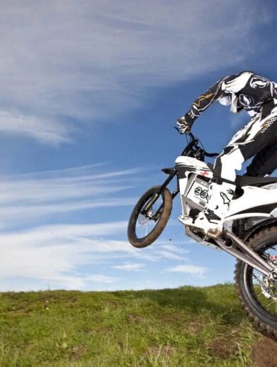A Zero Motorcycle and rider hopping a hill. Media sourced from Asphalt & Rubber.
