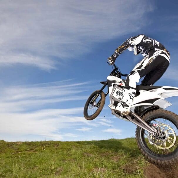 A Zero Motorcycle and rider hopping a hill. Media sourced from Asphalt & Rubber.