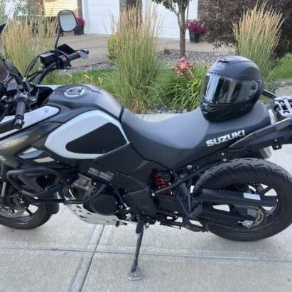 Bell Star DLX MIPS helmet resting on Suzuki motorcycle