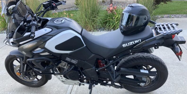 Bell Star DLX MIPS helmet resting on Suzuki motorcycle