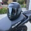 Viewport of Bell Star DLX MIPS helmet visible while helmet is resting on seat of Suzuki bike