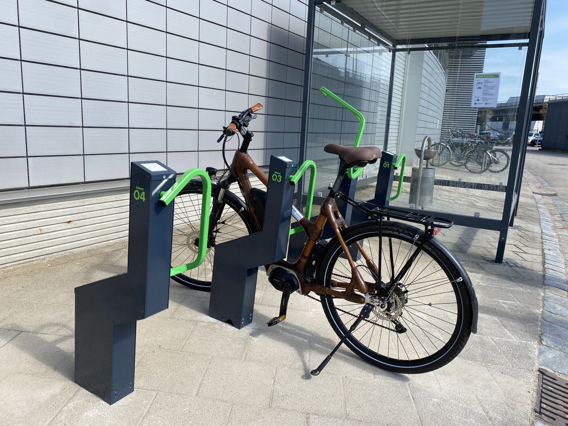 An eBike locked to a public bicycle rack.