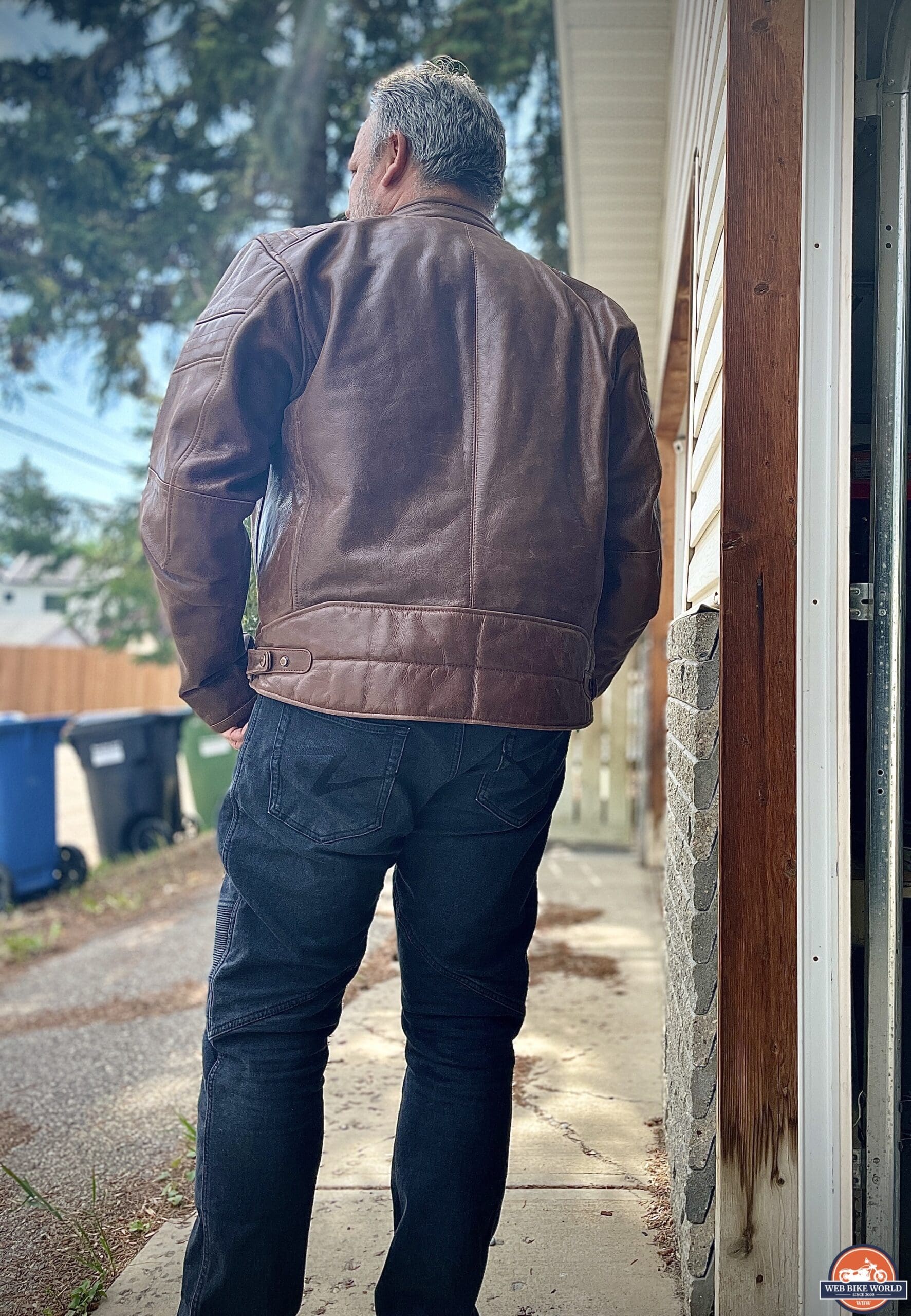 Rear of author wearing REV'IT Restless leather jacket outside