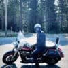 Author riding motorcycle through Canadian Rockies in Scorpion EXO Covert Ultra Jeans