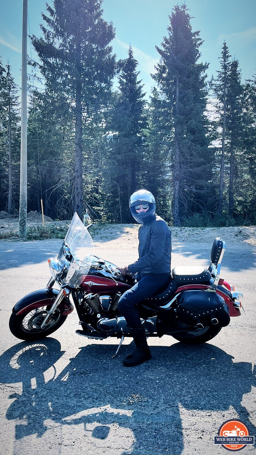 Author riding motorcycle through Canadian Rockies in Scorpion EXO Covert Ultra Jeans