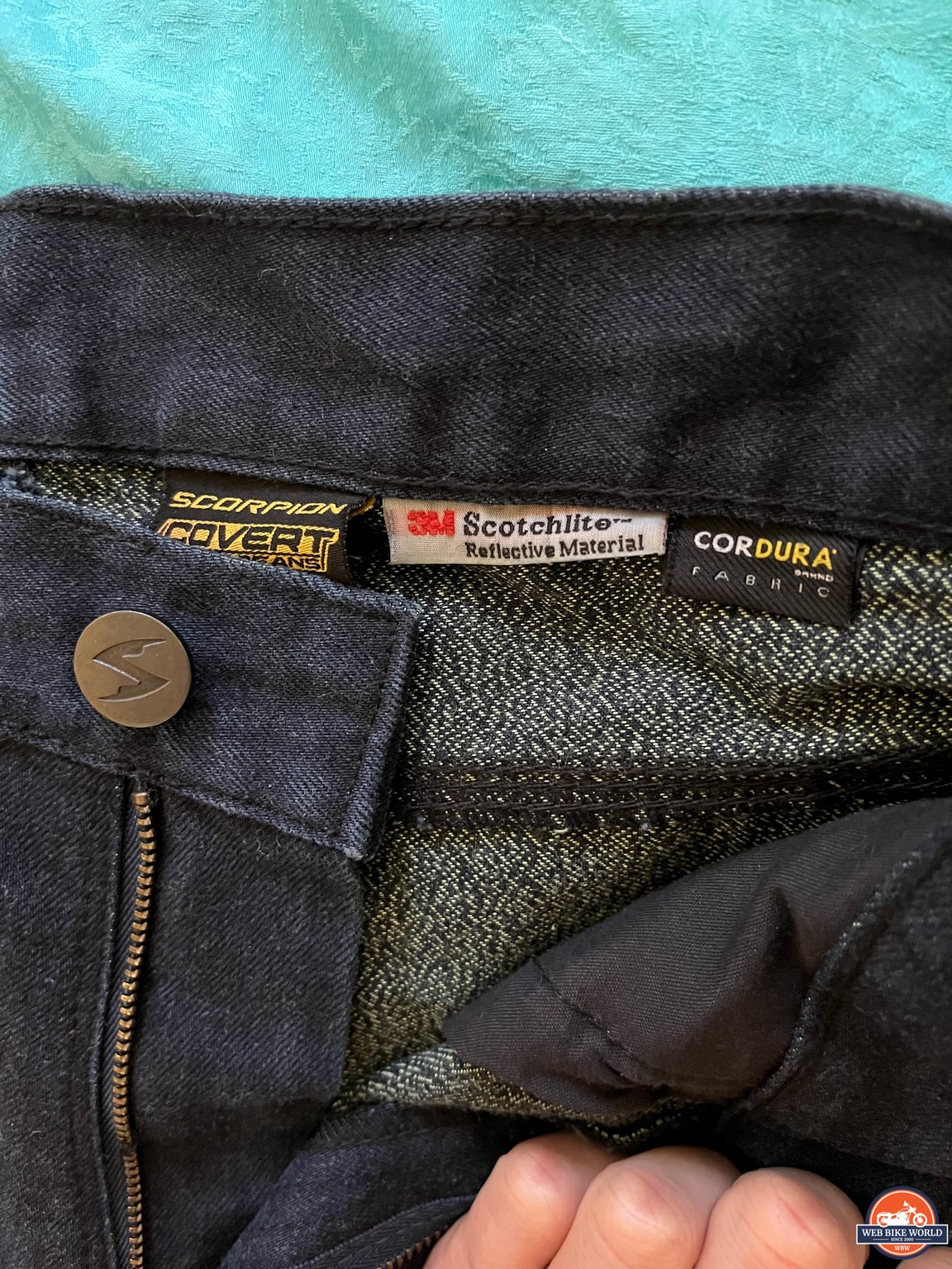 Close-up on zipper and button for Scorpion EXO Covert Ultra Jeans