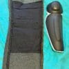 Optional knee armor lying next to inside-out leg of Scorpion EXO Covert Ultra Jeans