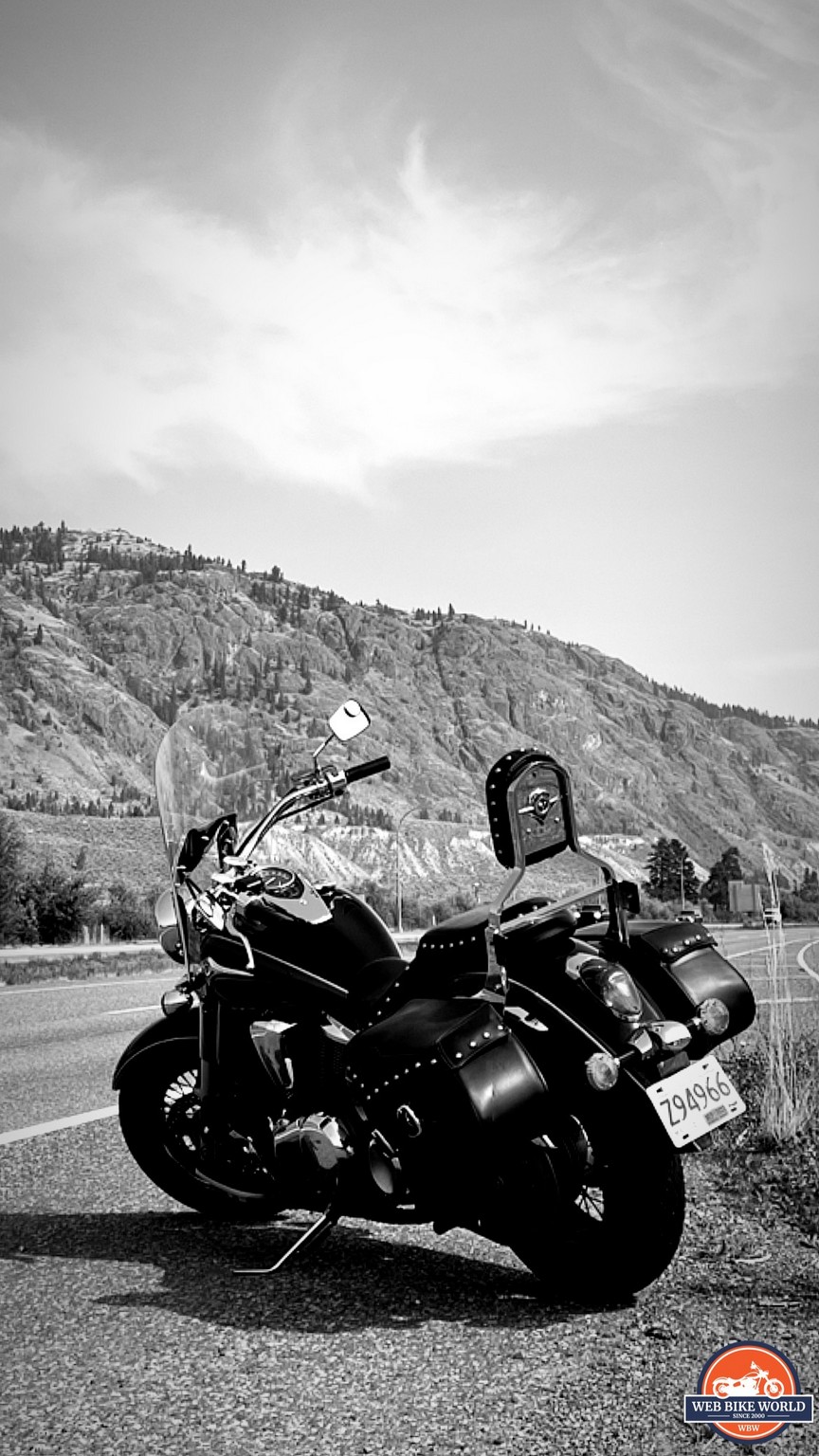 Author's motorcycle parked on shoulder of mountain road during testing for Scorpion EXO Covert Ultra Jeans