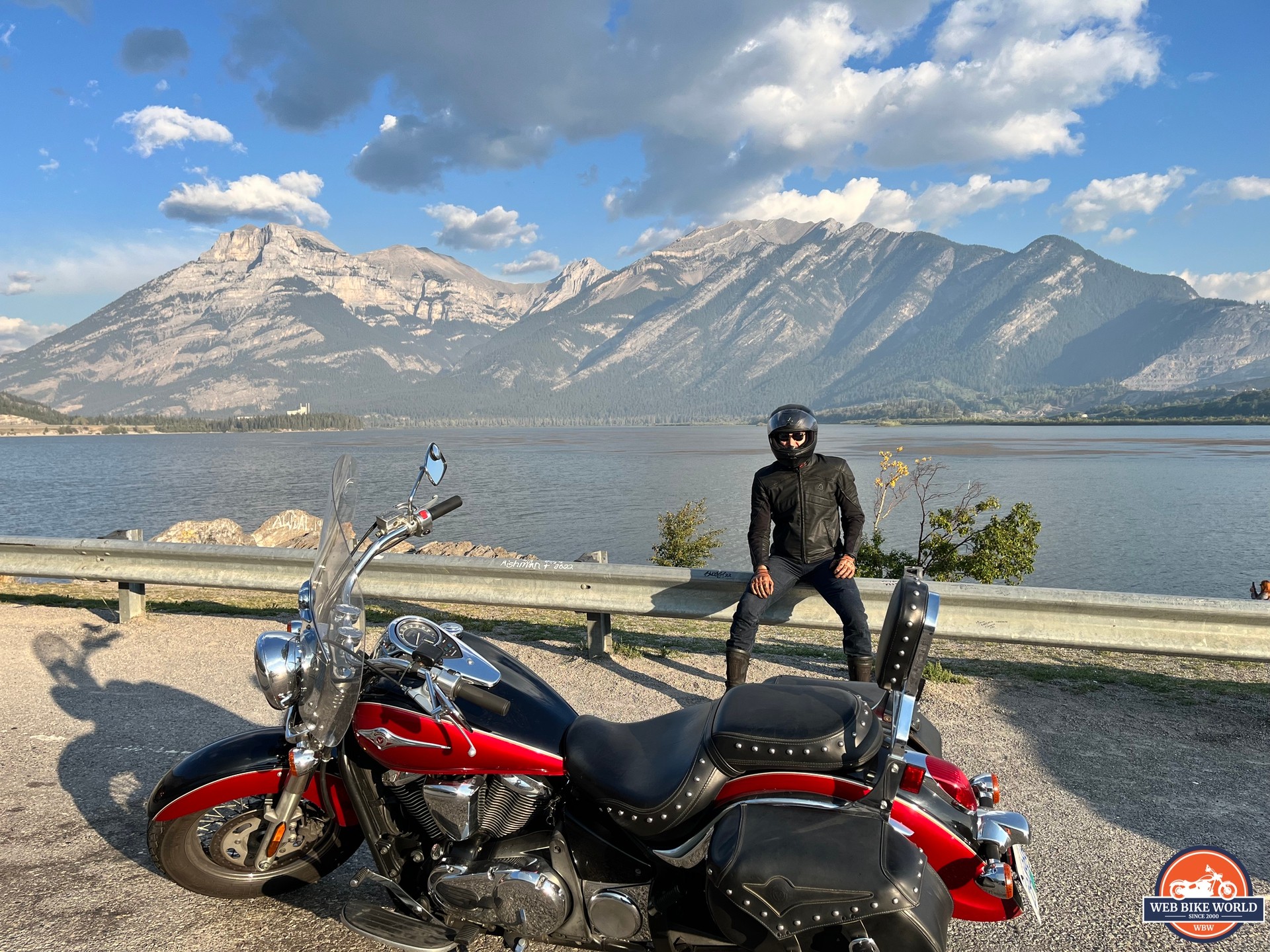 Author resting near mountain lake in Canadian Rockies while wearing Scorpion EXO Covert Ultra Jeans