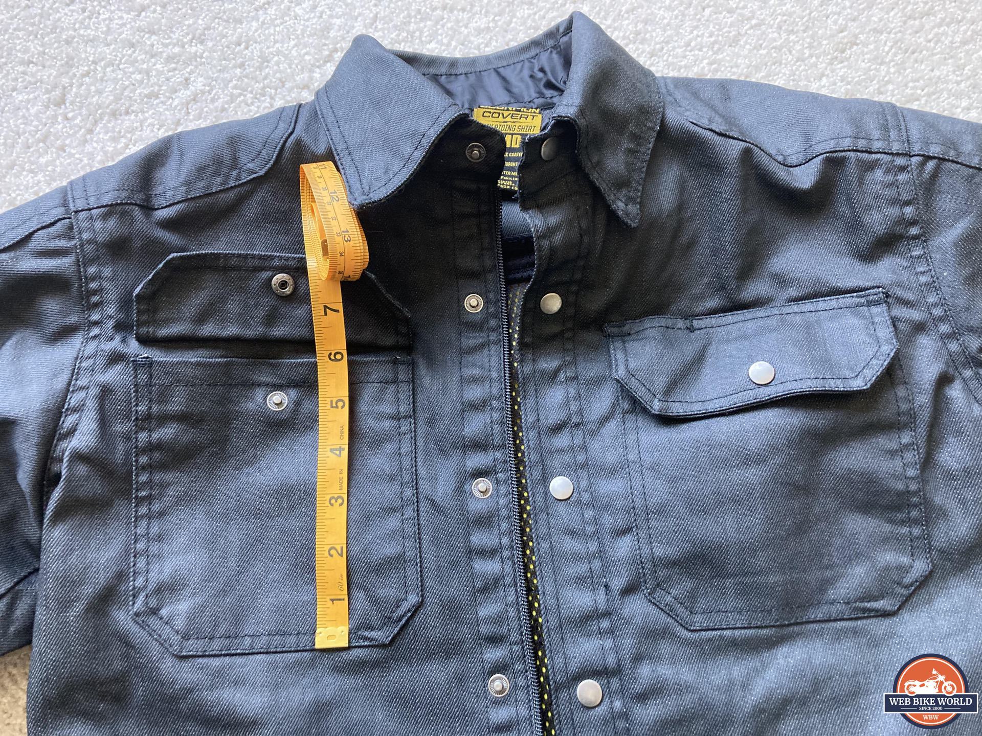 Measuring tape showing size of front pockets on Scorpion EXO Covert Waxed Riding Shirt