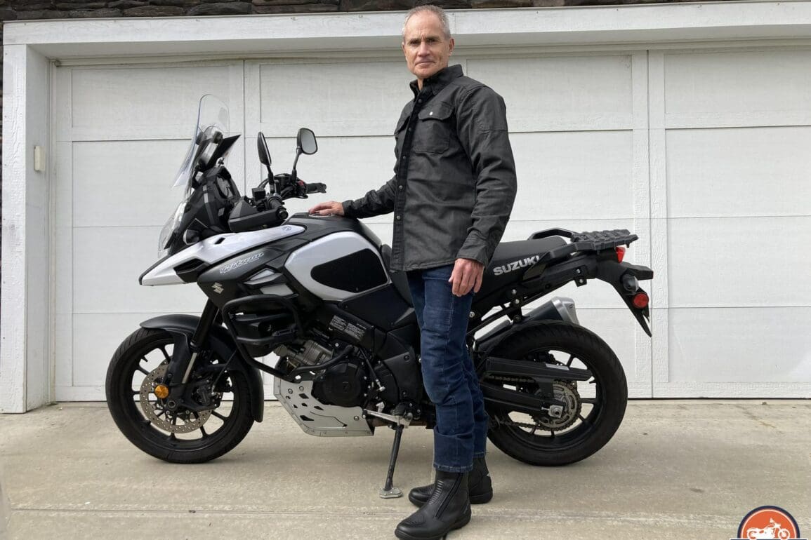 Author wearing Scorpion EXO Covert Waxed Riding Shirt next to motorcycle