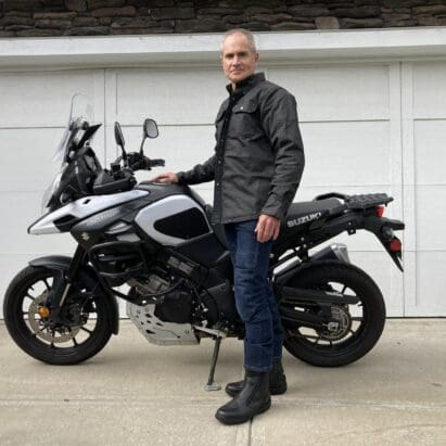 Author wearing Scorpion EXO Covert Waxed Riding Shirt next to motorcycle