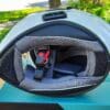 Sena OutForce Smart Helmet lying on side with interior liner visible