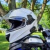 Sena OutForce Smart Helmet resting on motorcycle