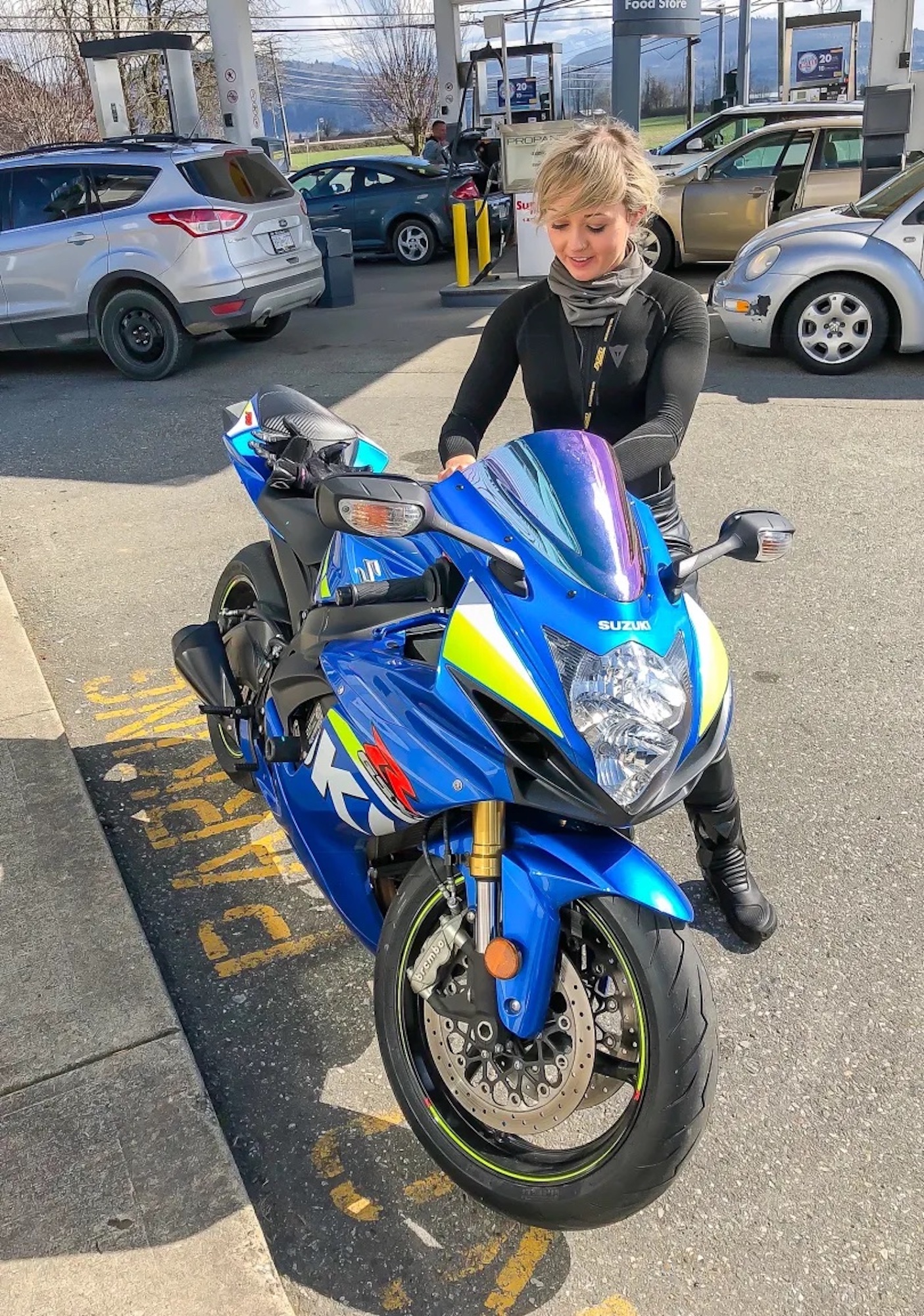 Amber Spencer filling her GSXR750 up with gas prior to a trackway. Media sourced from Tech 'N Wheels. 