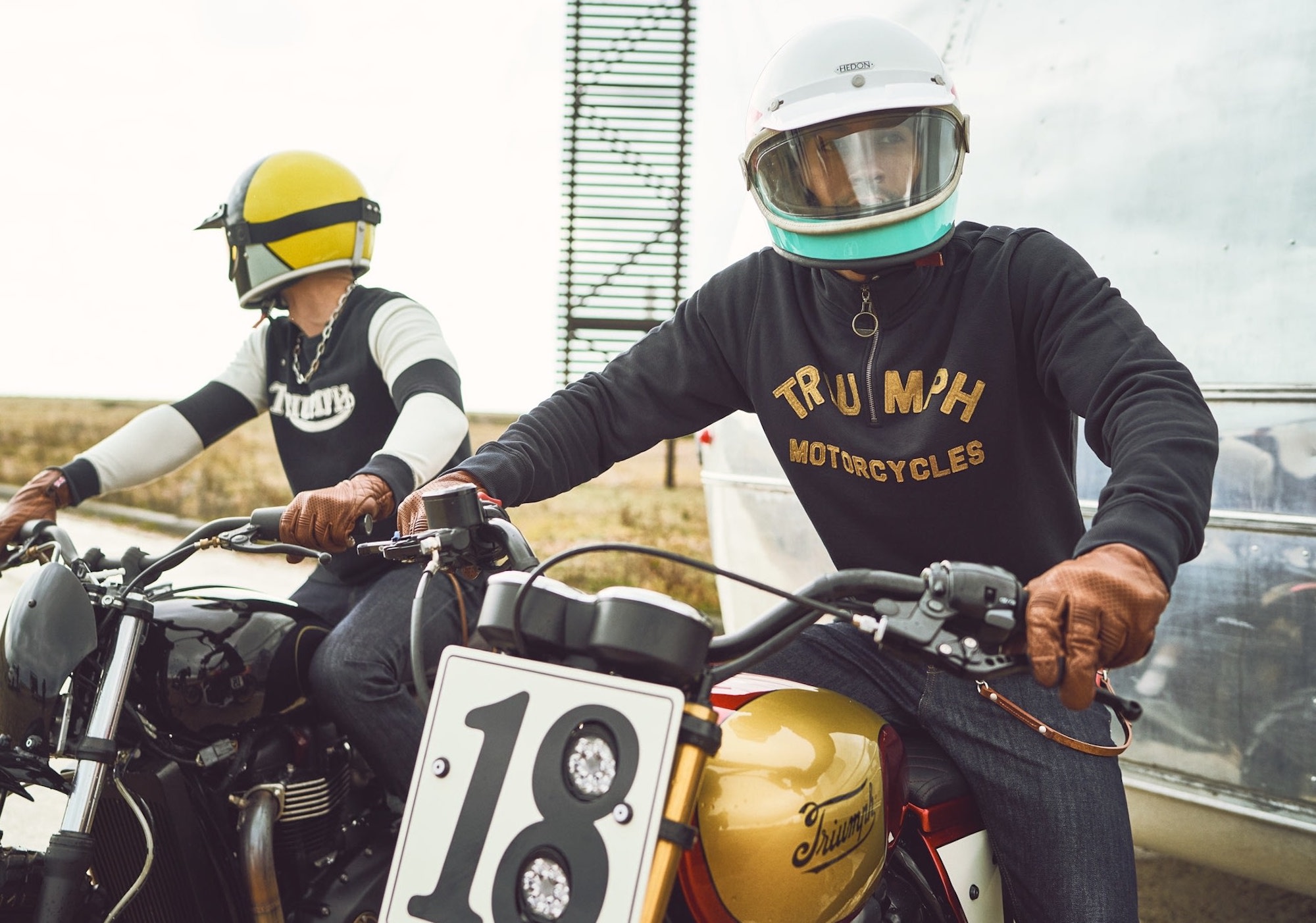 Two Triumph riders with visors down always mean business. Media sourced from The Coolector.