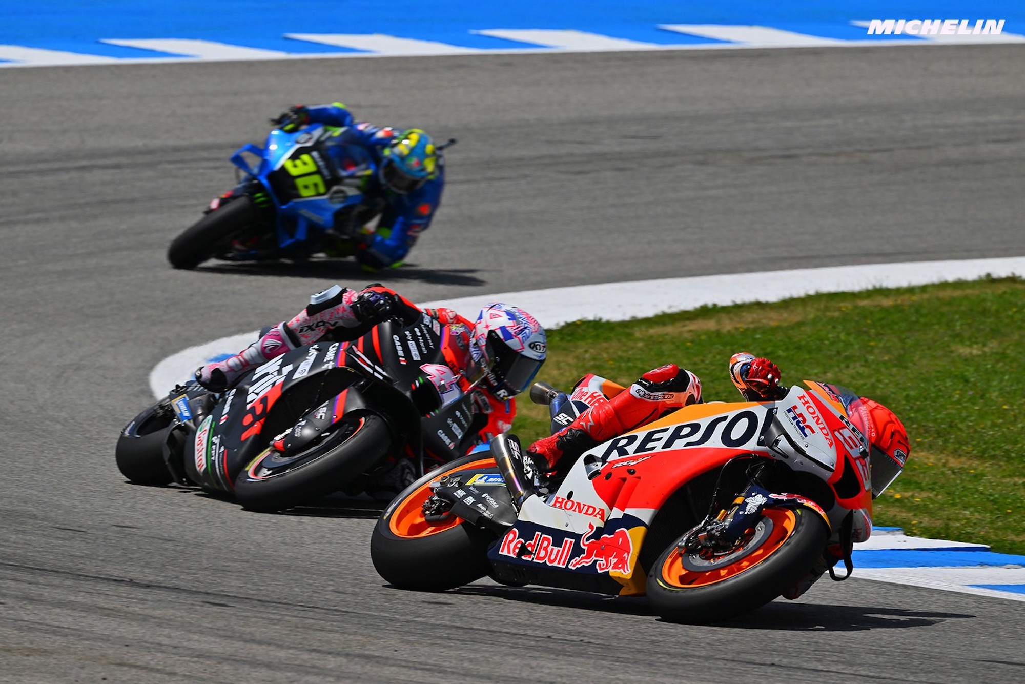 Joan Mir and Marc Marquez on the MotoGP circuit. Media sourced from Motorsport.