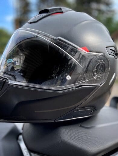 Nexx X.Vilitur Carbon Zero Pro helmet resting on motorcycle seat