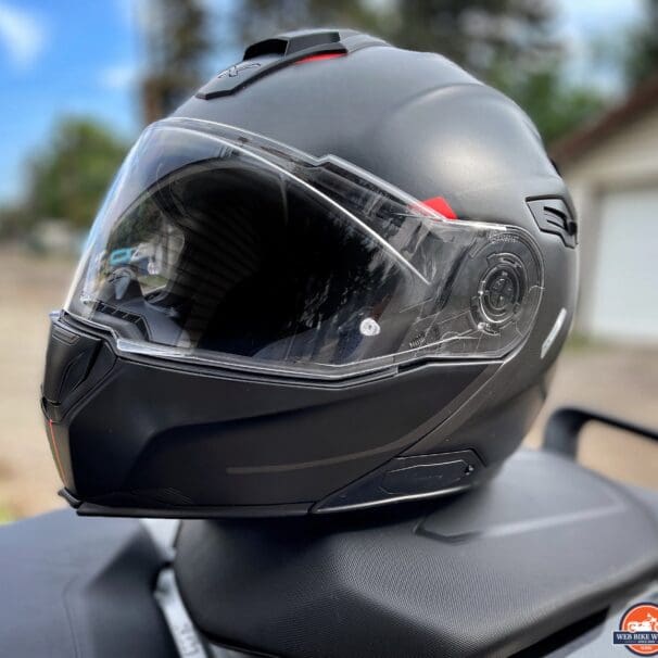 Nexx X.Vilitur Carbon Zero Pro helmet resting on motorcycle seat