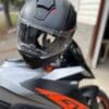 Nexx X.Vilitur Carbon Zero Pro helmet with KTM Super Duke GT in background