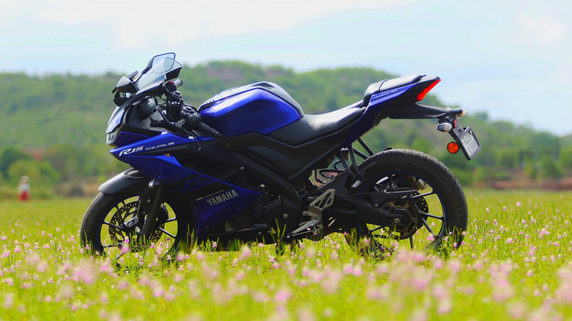 A Yamaha bike and rider in the pasture.  Media sourced from PixaHive.