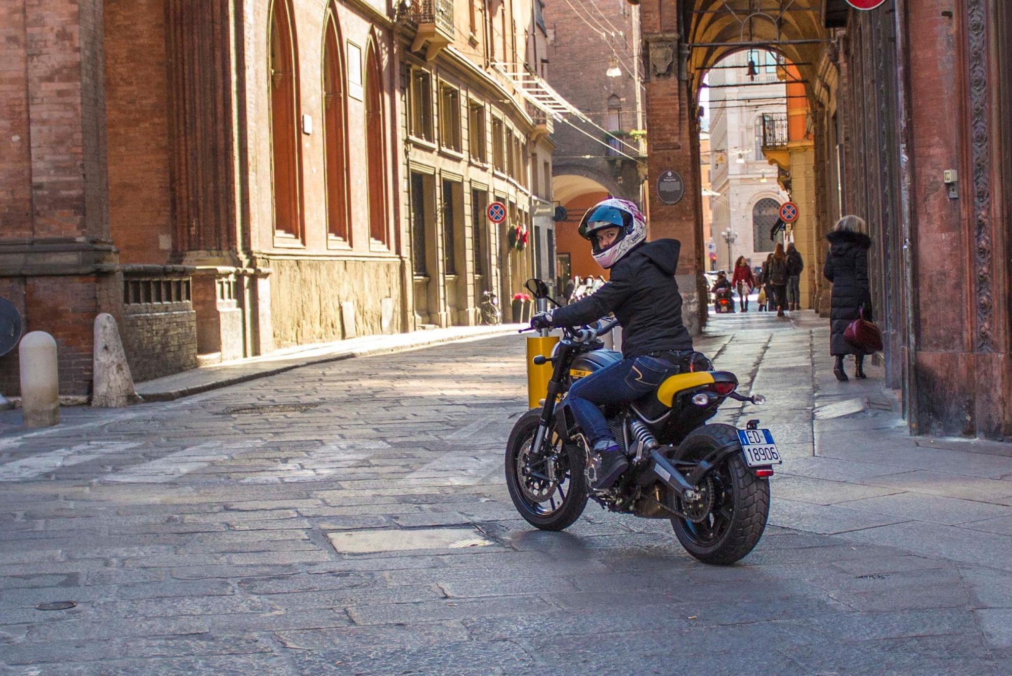 MissBiker enjoying a scoot around some of Italy's points of interest. Media sourced from Motorcycle.com.