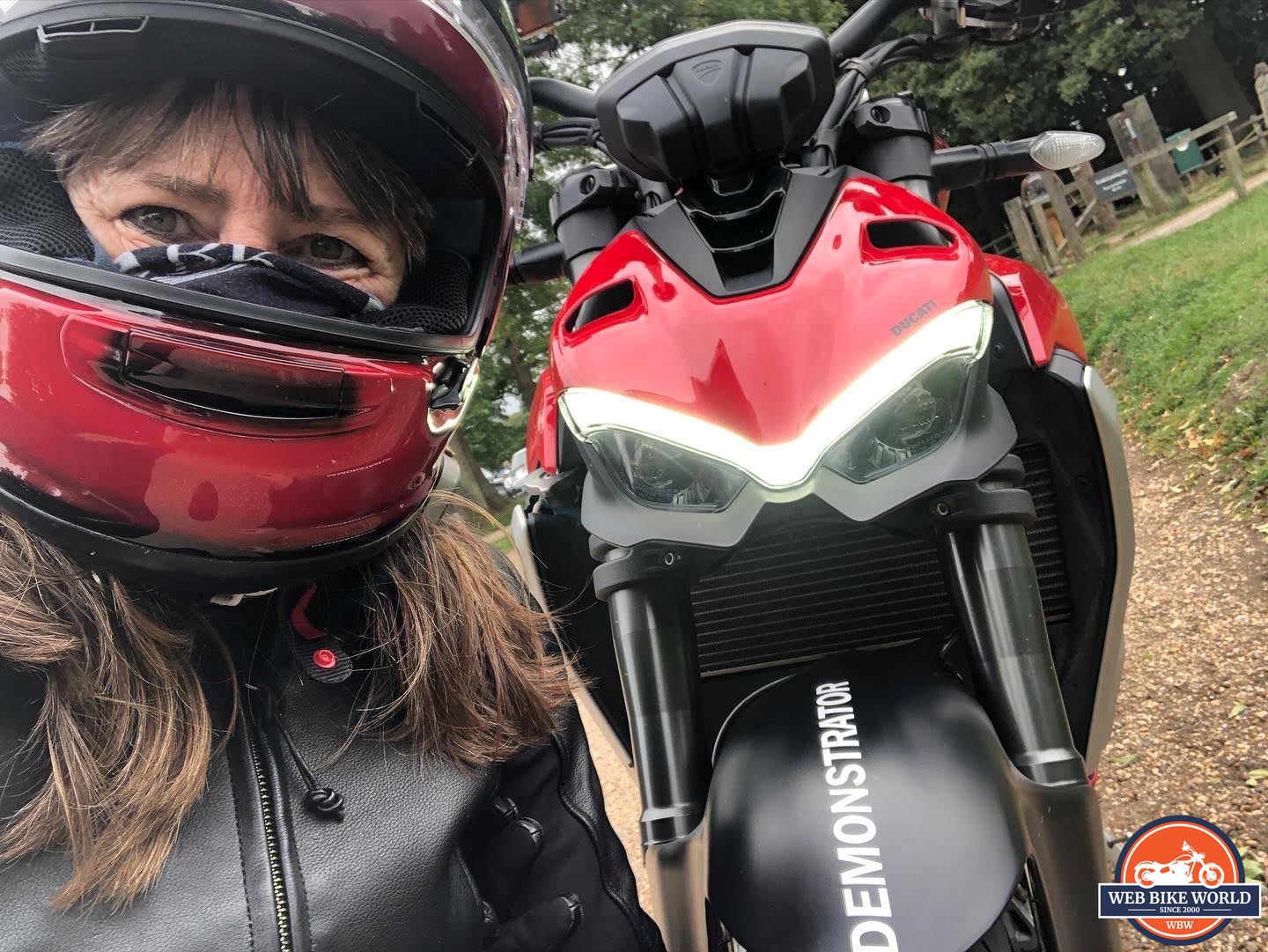 Author wearing helmet next to 2022 Ducati V2 Streetfighter