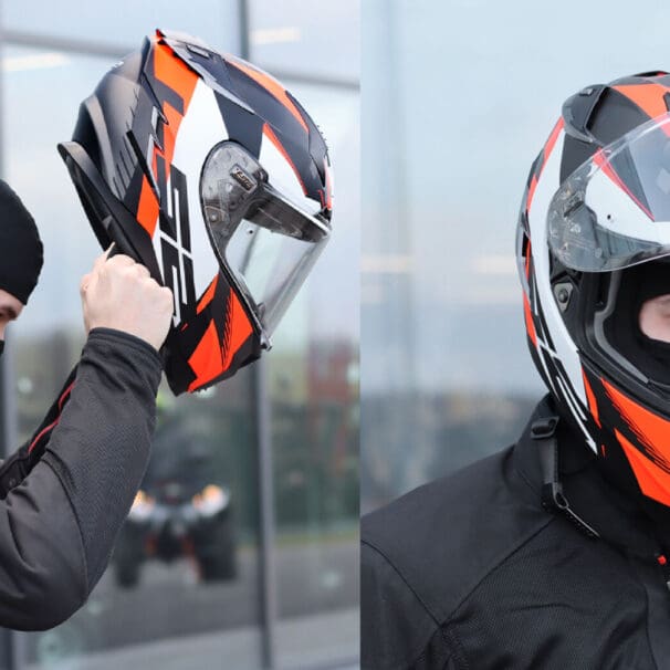 An image of a rider wearing a balaclava putting on his helmet.